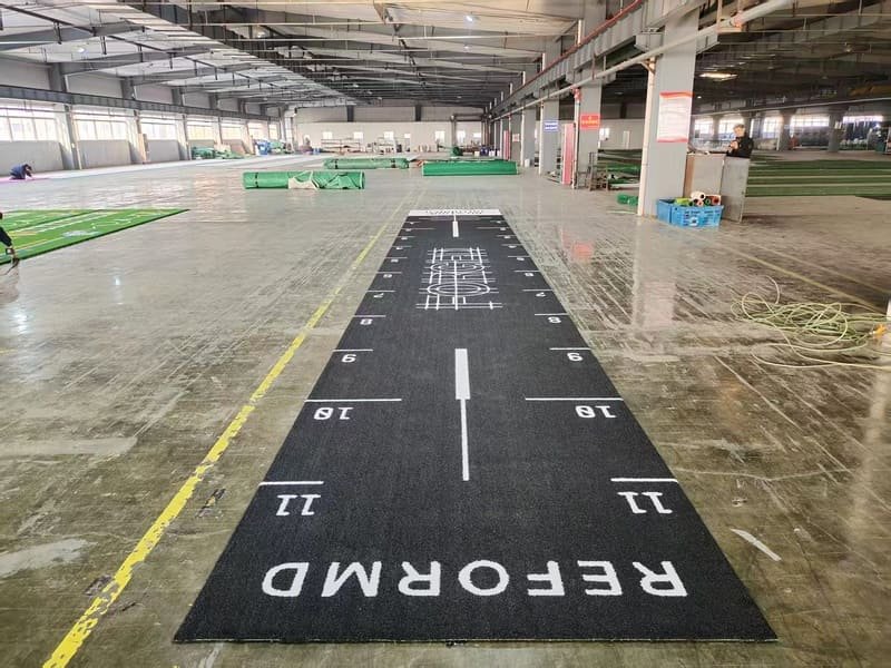 Technician measuring G-Max shock absorption on gym turf